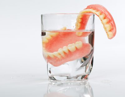 featured image for implants or dentures